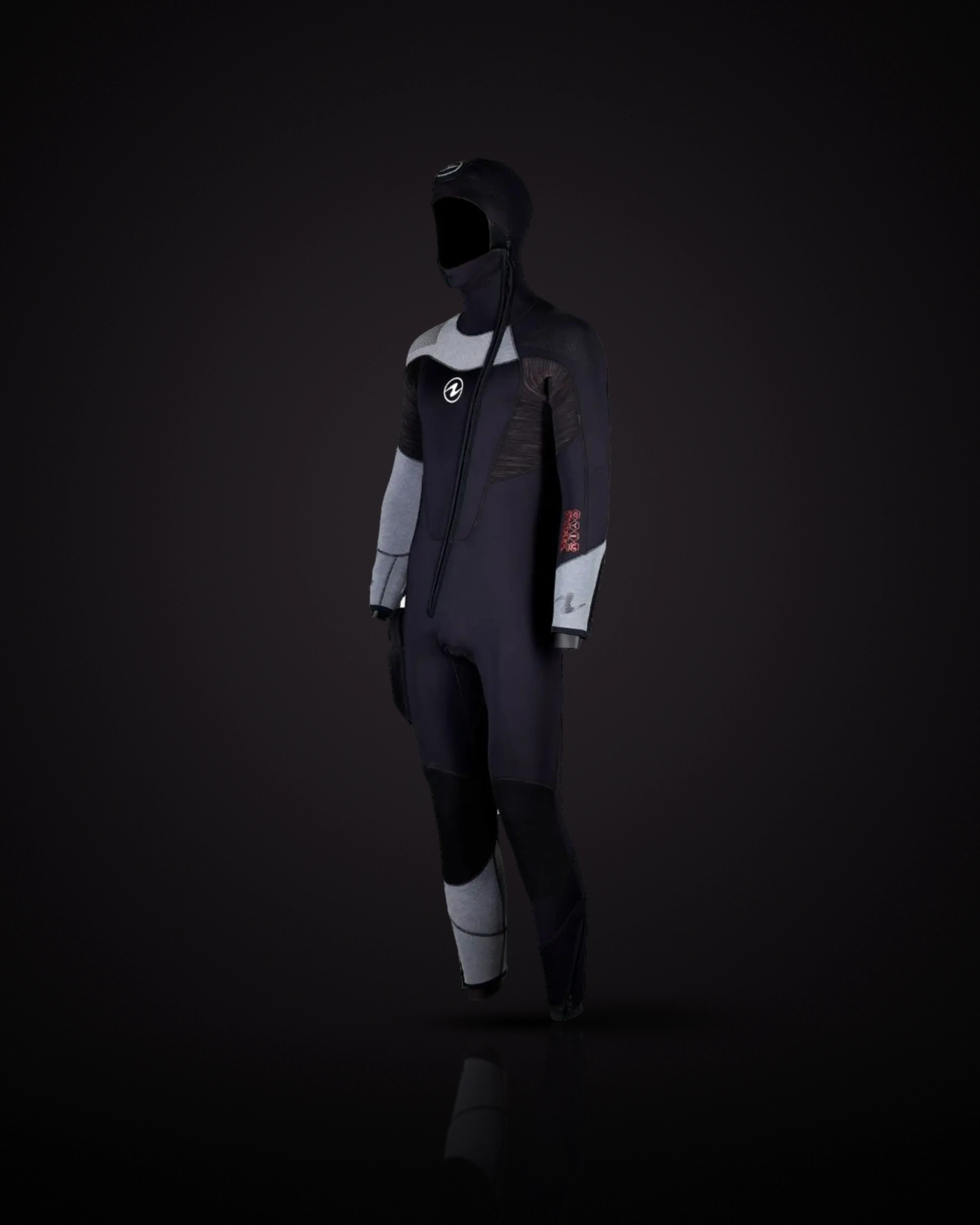 Aqualung DynaFlex 7mm Men's with Hood in Black/Red, three-quarter front view: a black suit with a black hood carrying the Aqualung logo on top, a long front zip running diagonally from the neck to the waist, grey panels on the shoulder and forearms, dark streaked panels on the upper arms, red DYNAFLEX lettering on the left arm, the Aqualung logo on the chest, black kneepads, a grey panel on the lower right leg and a pocket on the right thigh