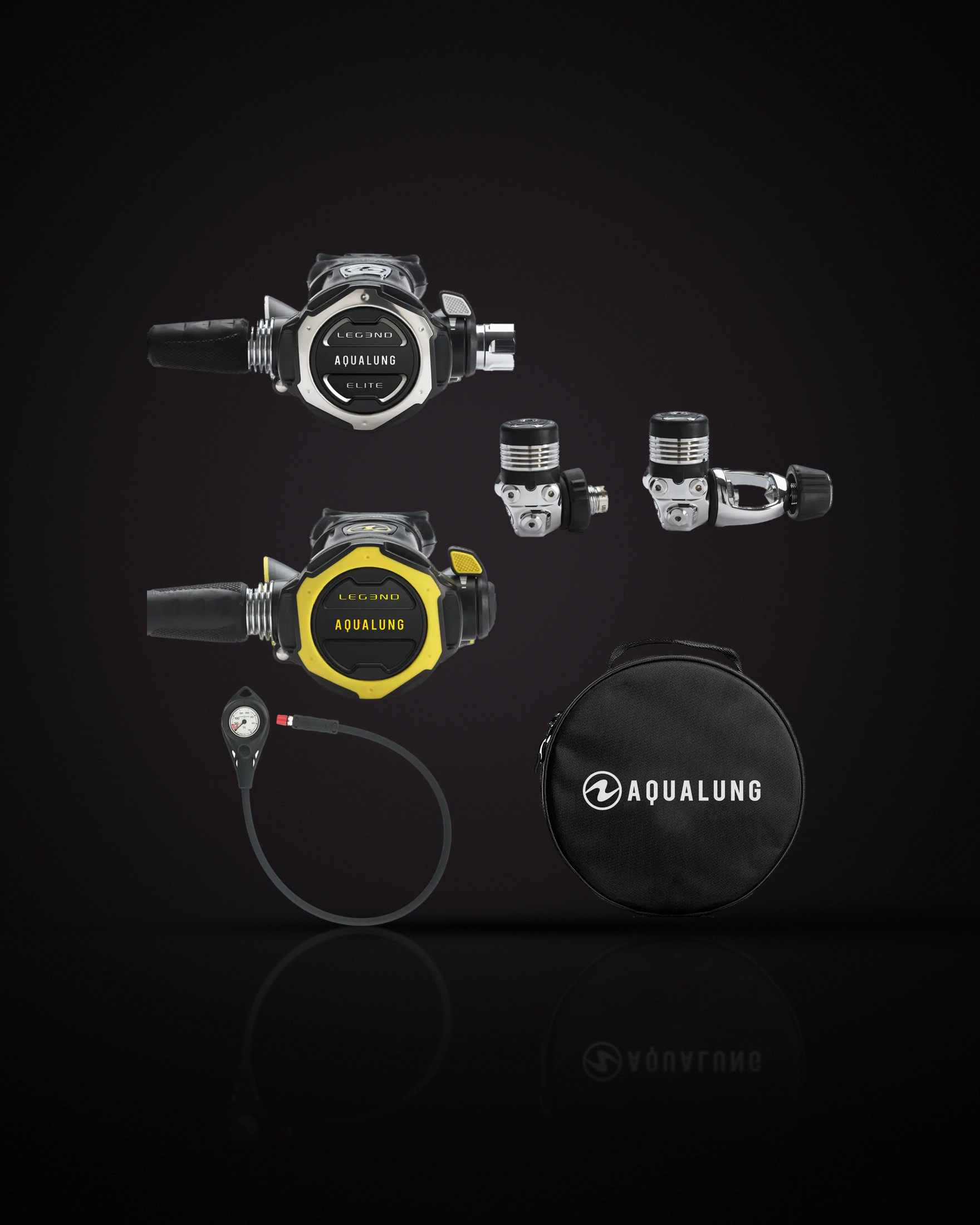 Aqualung Pack Leg3nd Elite: the second stage with the LEG3ND / AQUALUNG / ELITE cover at the top left, both first-stage versions side by side on the right (DIN on the left, INT yoke on the right), a yellow octopus marked LEG3ND / AQUALUNG below the second stage, a single pressure gauge on a black hose at the bottom left, and a round black zip bag with the AQUALUNG logo at the bottom right. The photo shows both first stages; the pack comes with the one you choose.